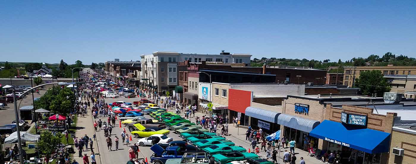 downtown and colorful carshow with large crowd gathered